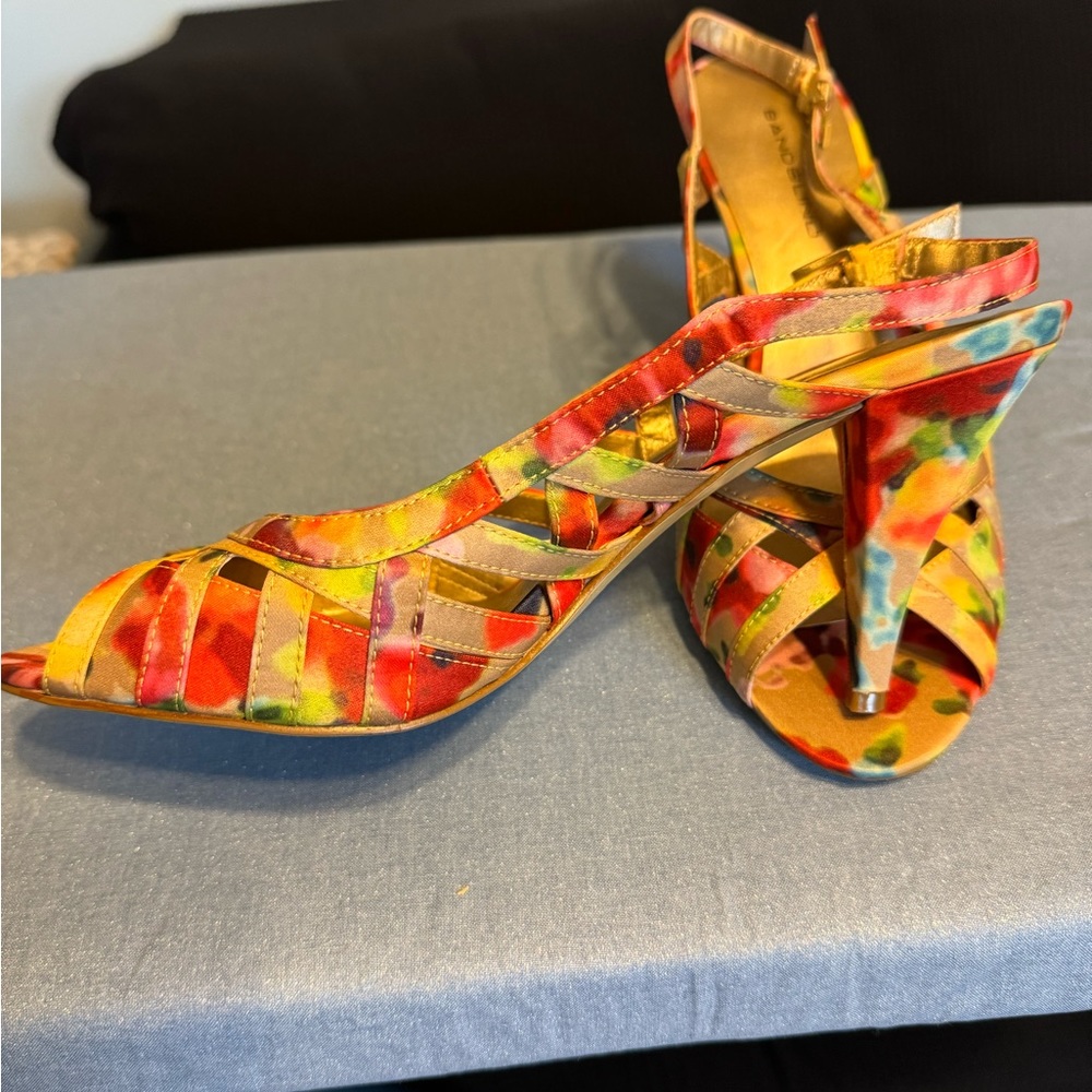 Multicolor sling back sandal with 2 to 3 inch heel.